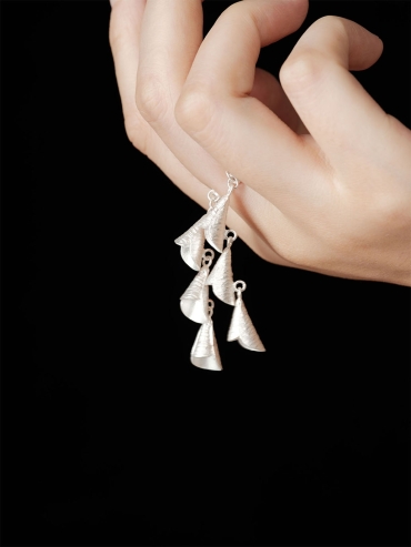 Silver rings with strings of bells