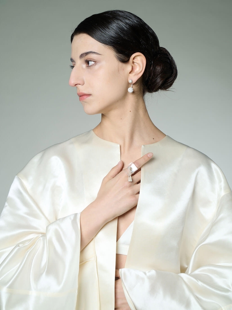 White flowing bell ring