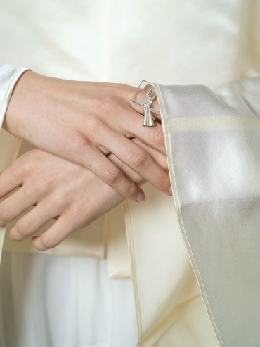 White flowing bell ring