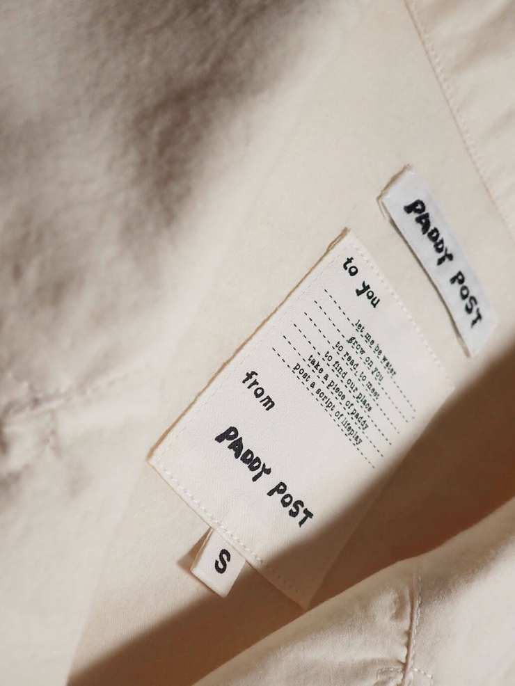 White shirt with a tailored stand collar and reversible lapel