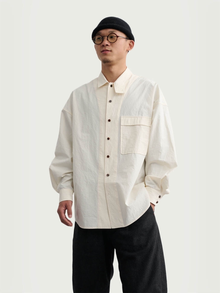 White shirt with a tailored stand collar and reversible lapel