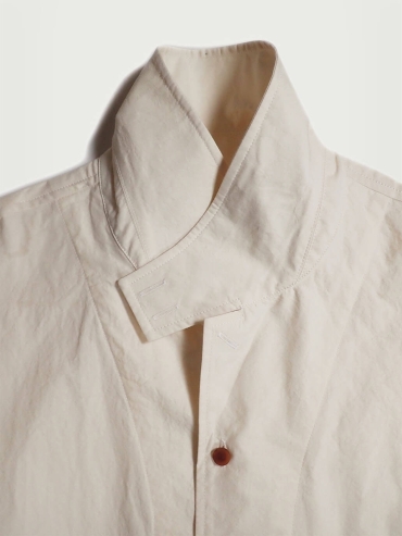 White shirt with a tailored stand collar and reversible lapel