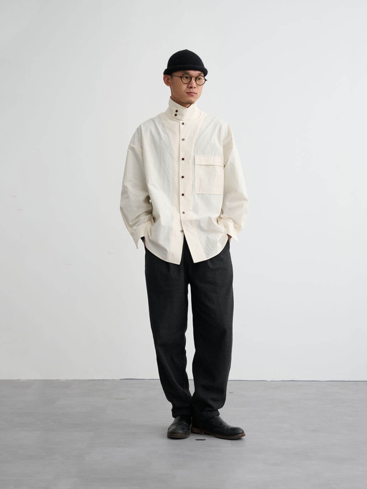 White shirt with a tailored stand collar and reversible lapel