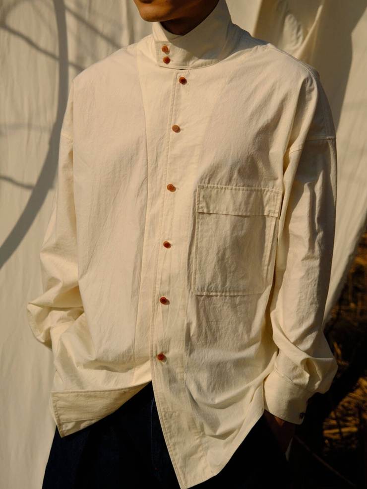 White shirt with a tailored stand collar and reversible lapel