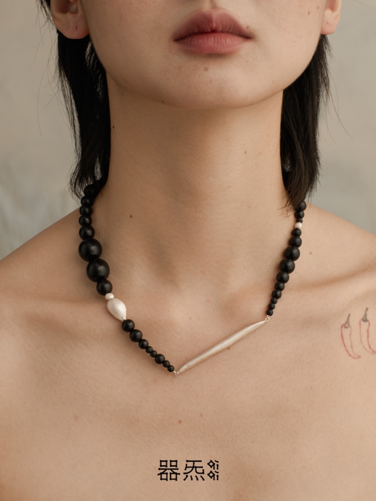 Ebony beading collar with sprout and seeds