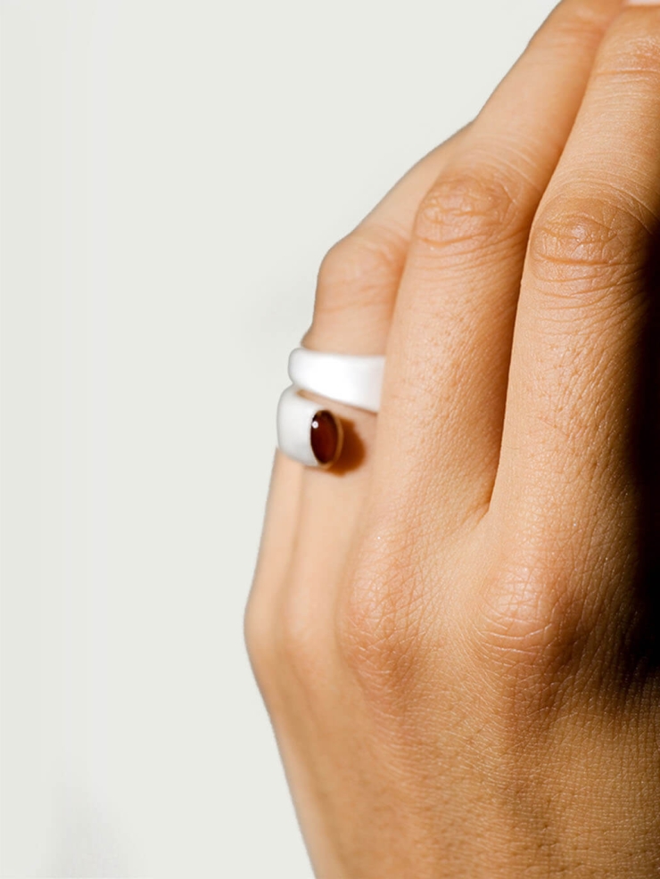 Silver and red revolve amber ring