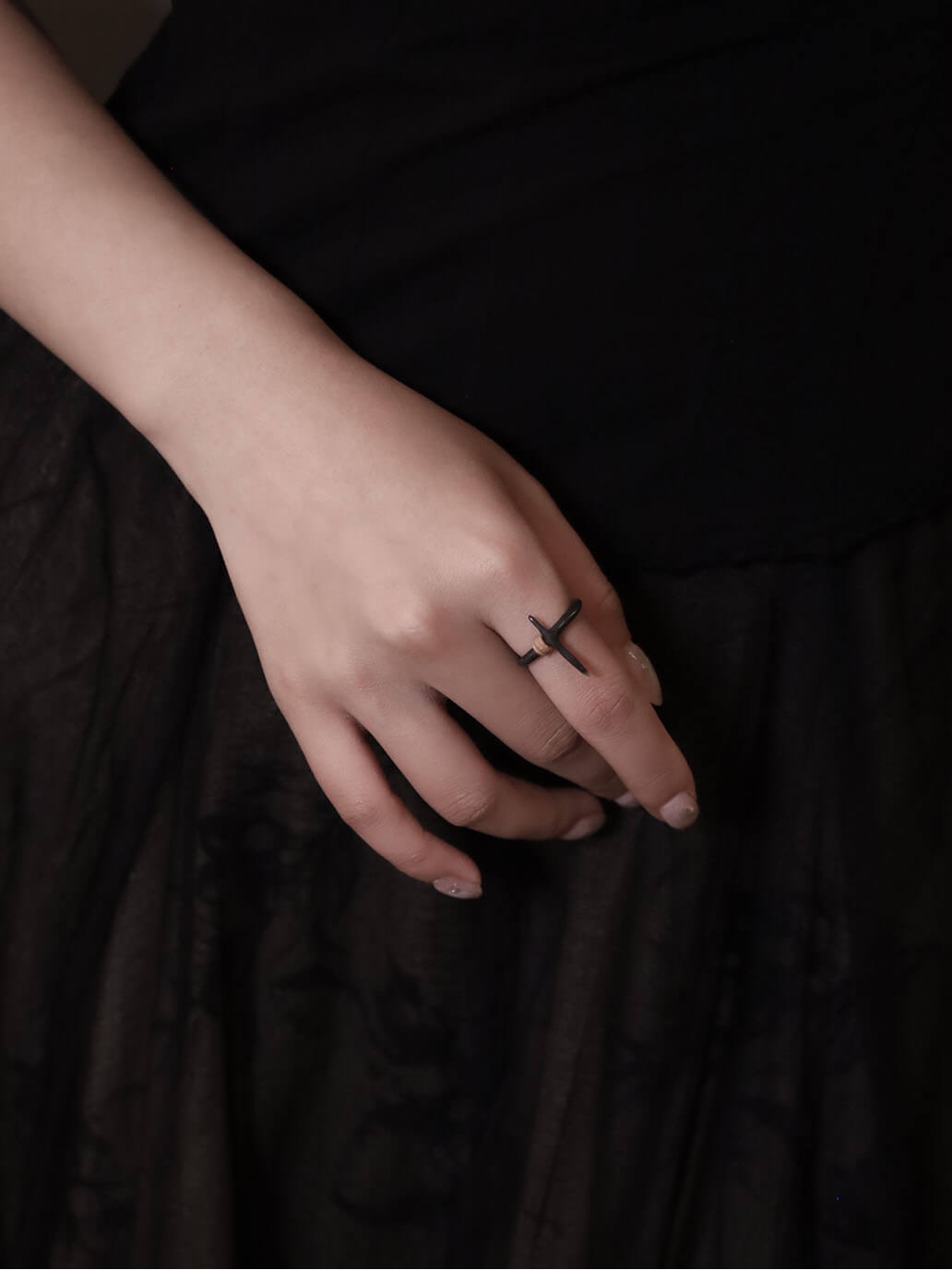 Black cruciform ring