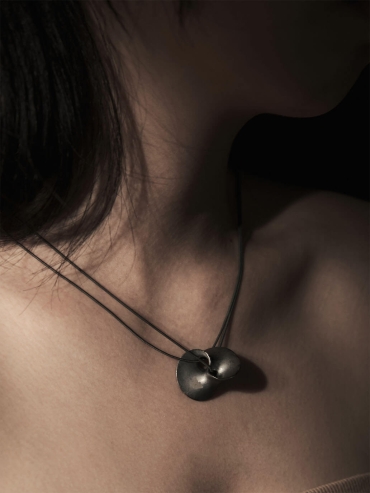 Black wormhole pendant necklace