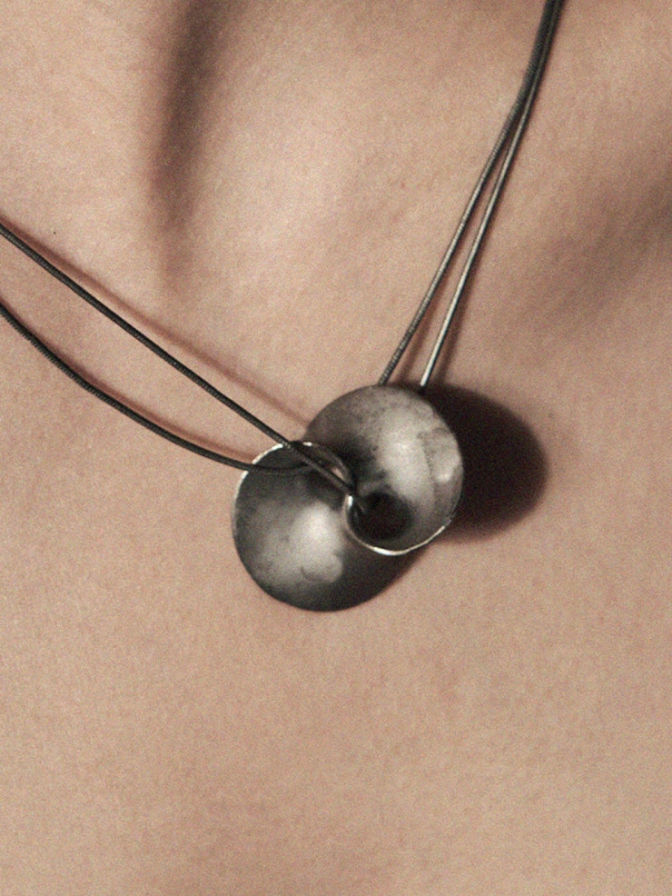 Black wormhole pendant necklace