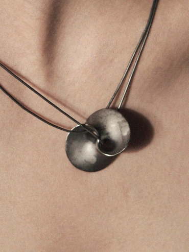 Black wormhole pendant necklace